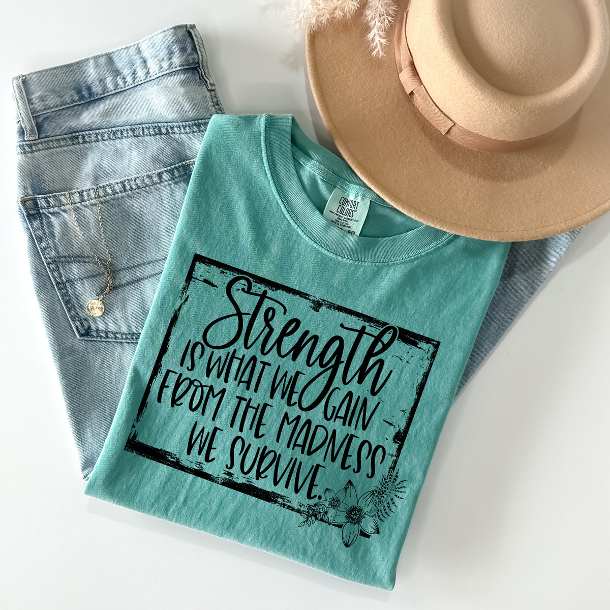 Strength is What We Gain Graphic Tee