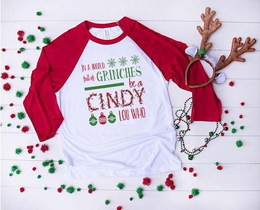 In A World Full Of Grinches Be Cindy Lou Who Graphic Tee Graphic Tee