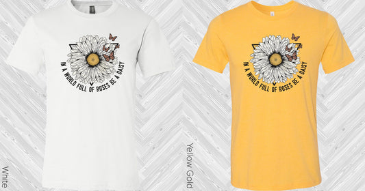 In A World Full Of Roses Be Daisy Graphic Tee Graphic Tee