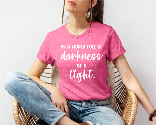 In a World Full of Darkness Be a Light Graphic Tee