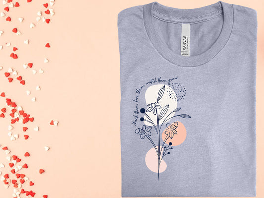 Teach Them Love Watch Grow Graphic Tee Graphic Tee