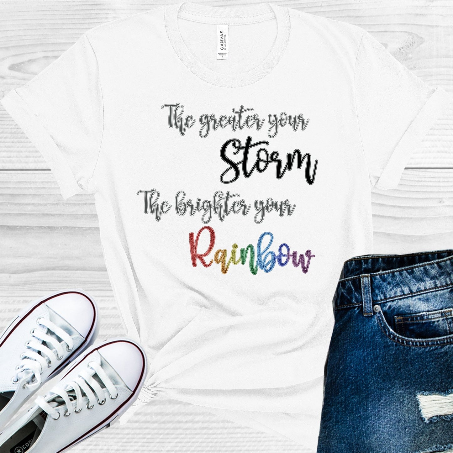 The Greater Your Storm Brighter Rainbow Graphic Tee Graphic Tee